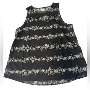 Mudpie black and white rose patterned sleeveless top. Modest neckline and light
